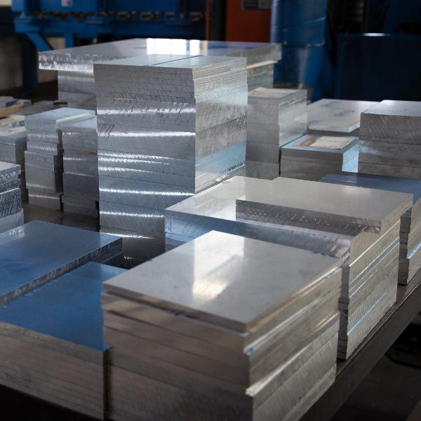 https://www.coremarkmetals.com/files/image/medium/Cast aluminum plate cut squares stacked on table